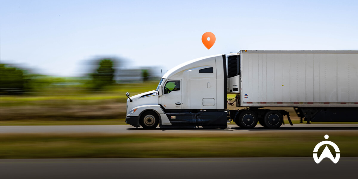 Cartrack showing what is most effective GPS tracker as white semi-truck rolls down highway with location pin glowing above.
