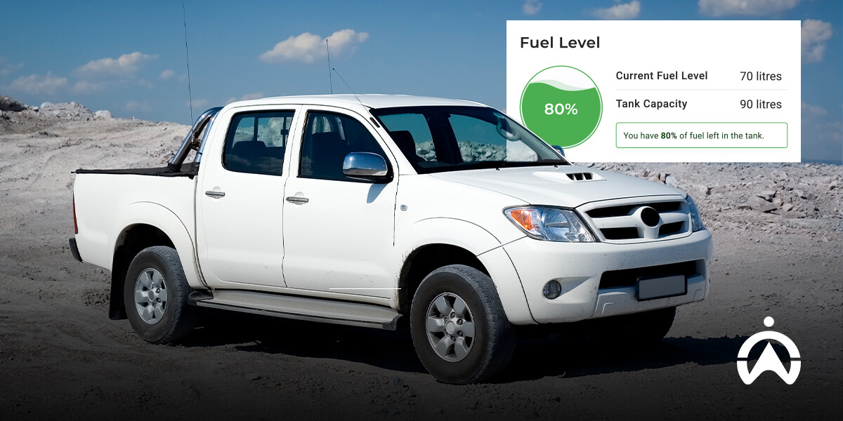 Cartrack highlighting what is a good fleet car with white pickup on sand showing 80% fuel and 70L left to roll further.