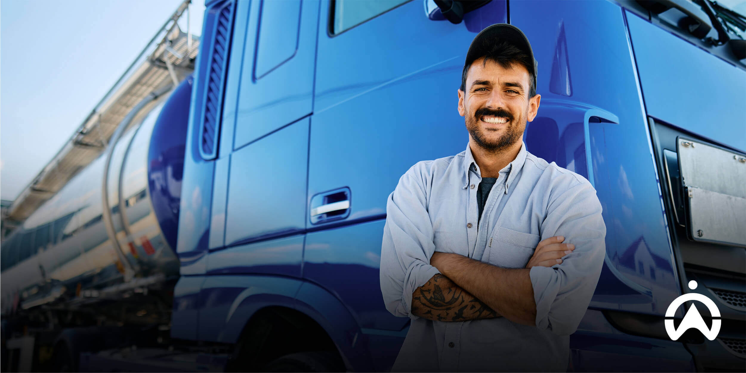 Fleet manager standing by truck representing an API-first fleet management system.