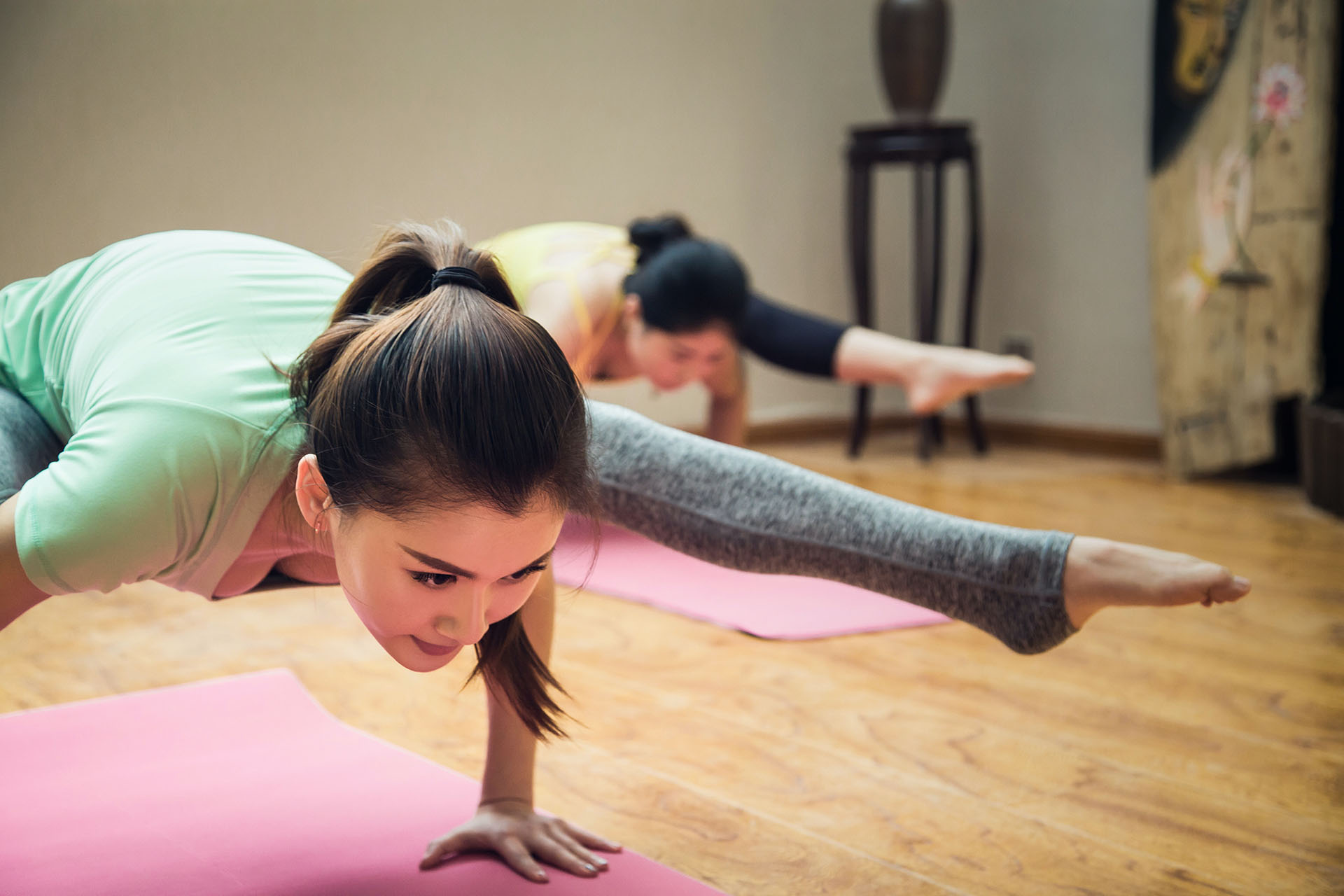 Two woman doing yoga