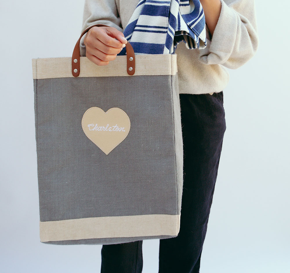 People celebrating at an event with a customized market sitting at the center of the table