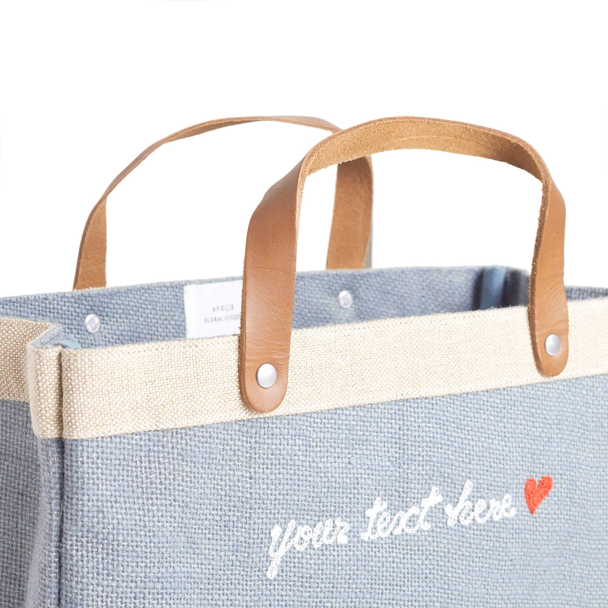 People leaving an event with their market bags