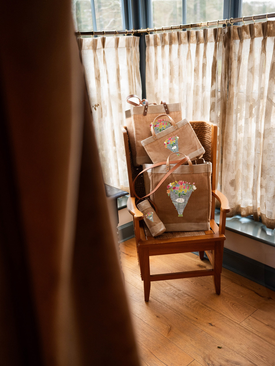 A market bag hanging on a chair at an event
