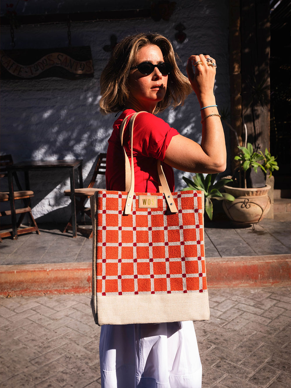 A market bag hanging on a chair at an event