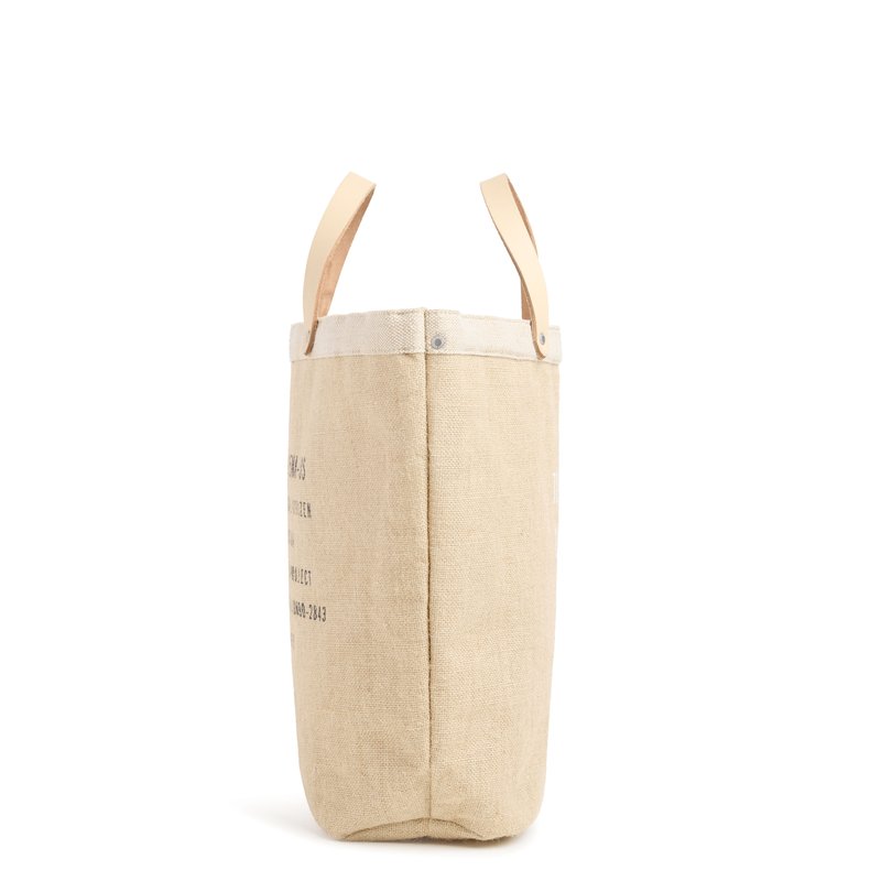 People leaving an event with their market bags