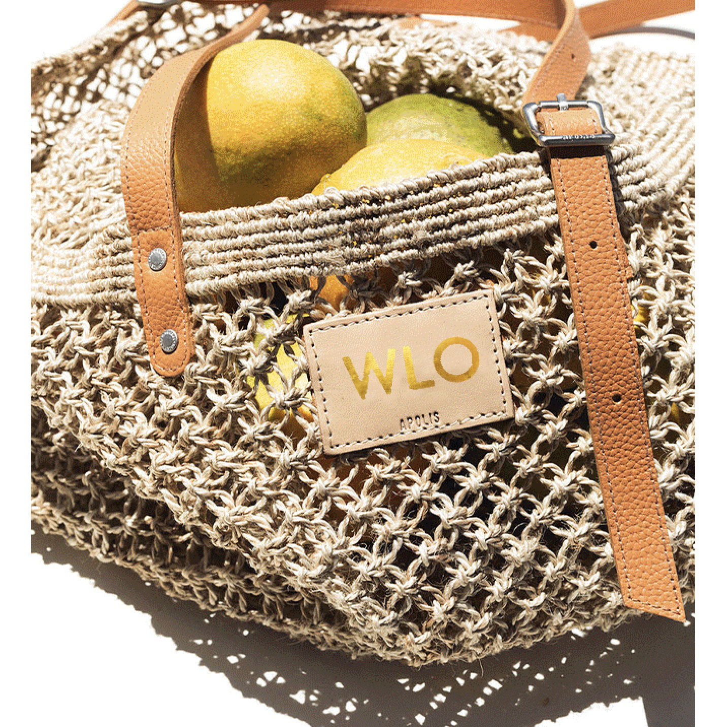 People leaving an event with their market bags