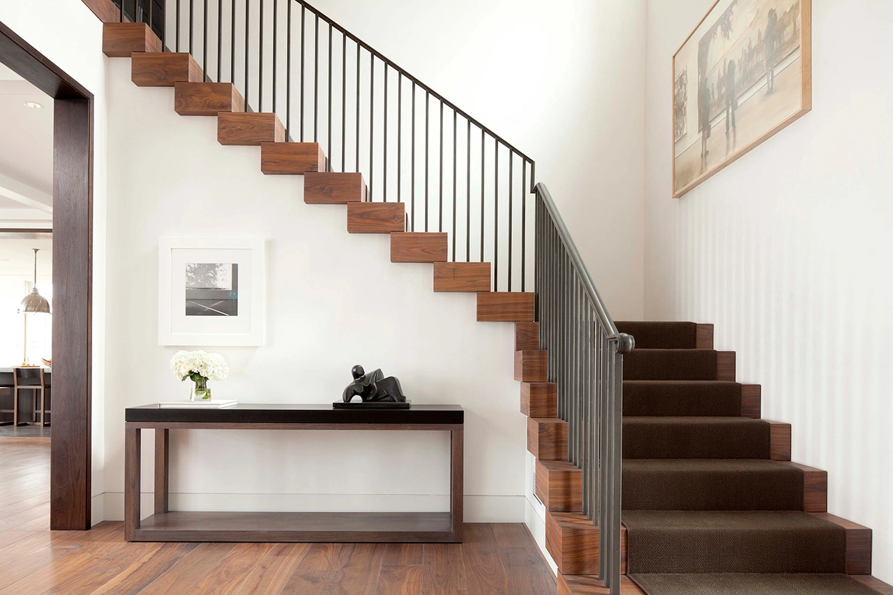 Modern home interior showcasing a completed and stunning maple staircase Modern home interior showcasing a completed and stunning maple staircase