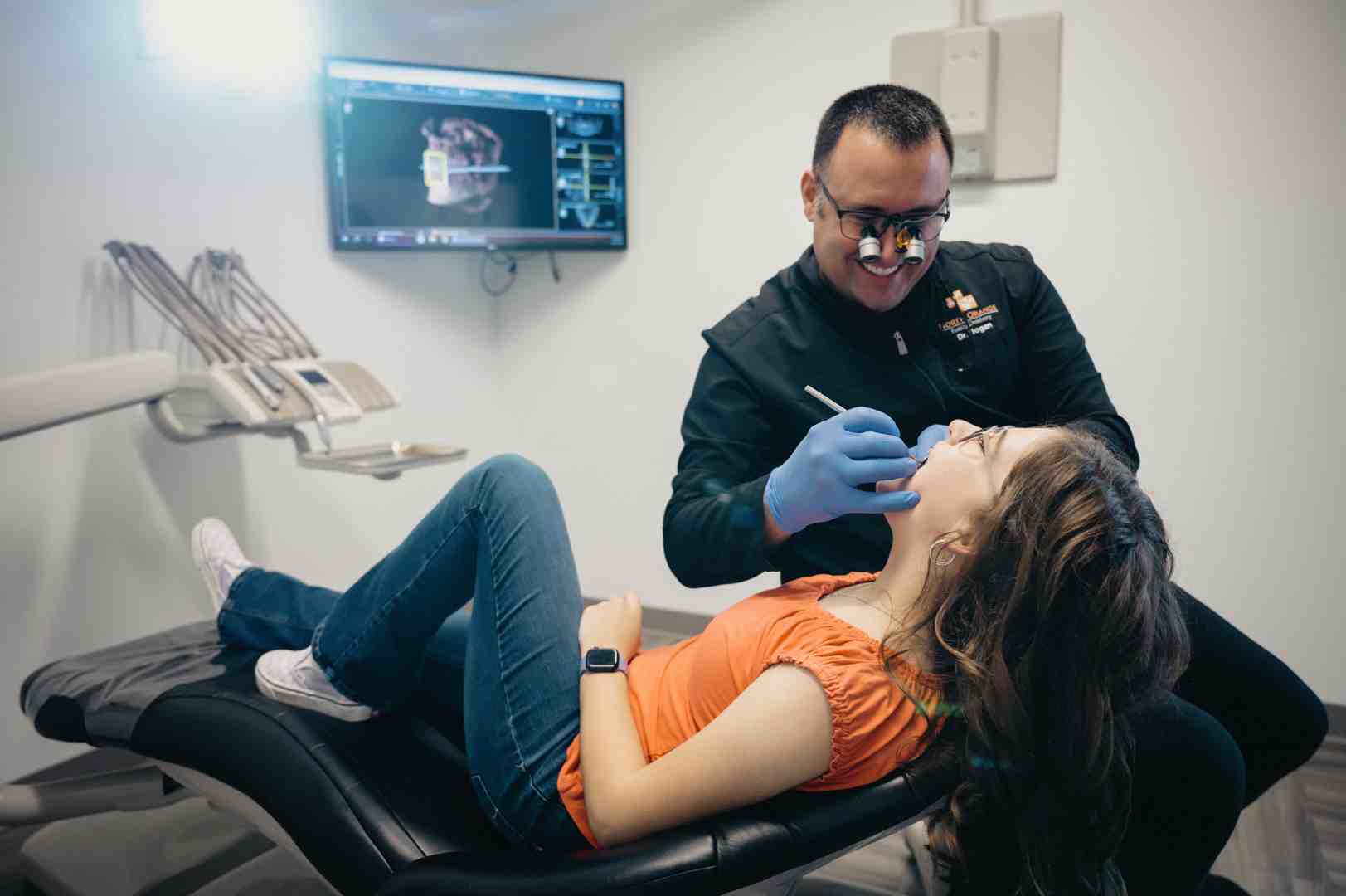 image of a dentist examining a patient's jaw - brucism