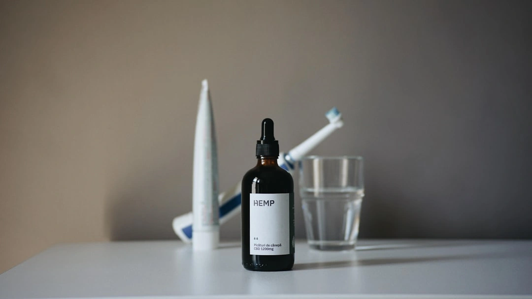 Dental care items including a glass of water and soft-bristled toothbrush - what not to do after a root canal Dental care items including a glass of water and soft-bristled toothbrush - what not to do after a root canal