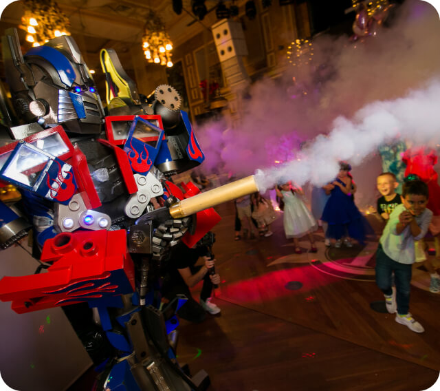 Optimus Prime shooting out foam of his foam gun