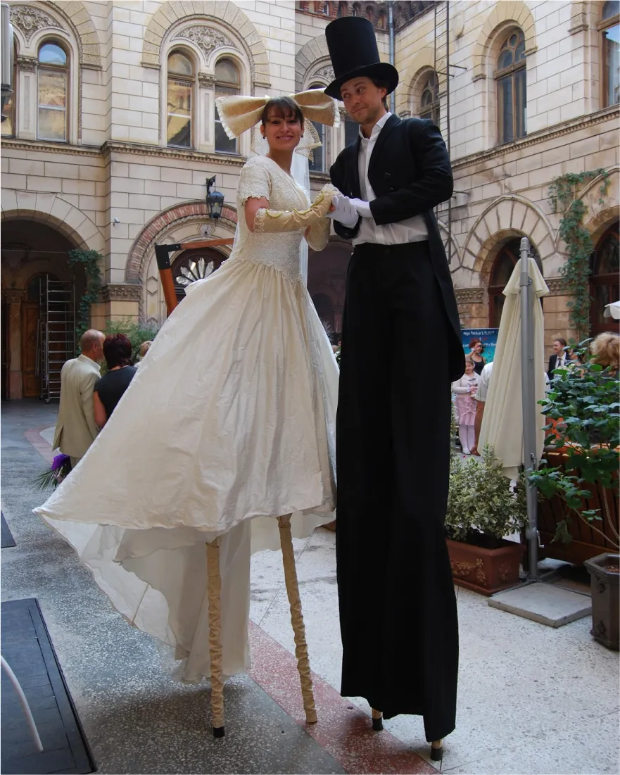 A stlit walker couple posing for a photo at a party