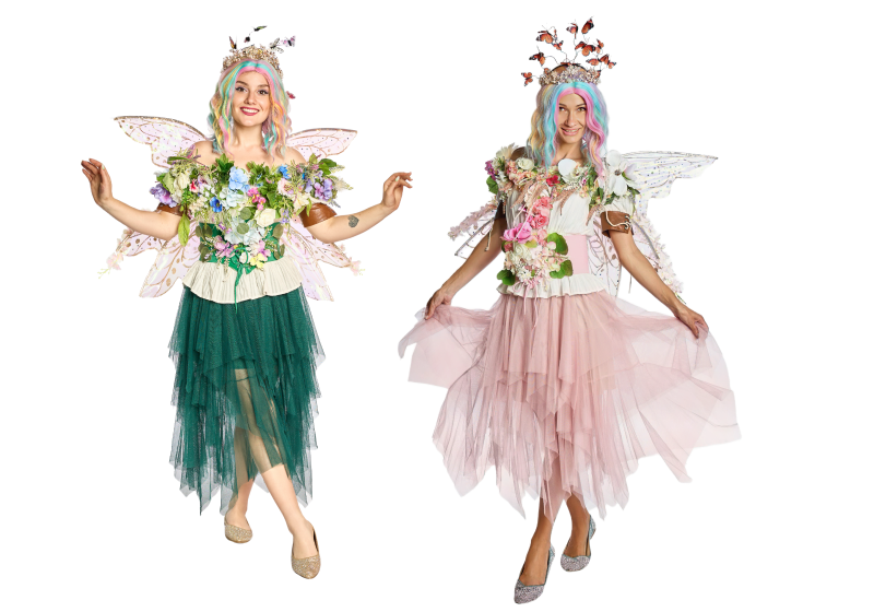 A fairy taking posing for a picture in front of the flowers