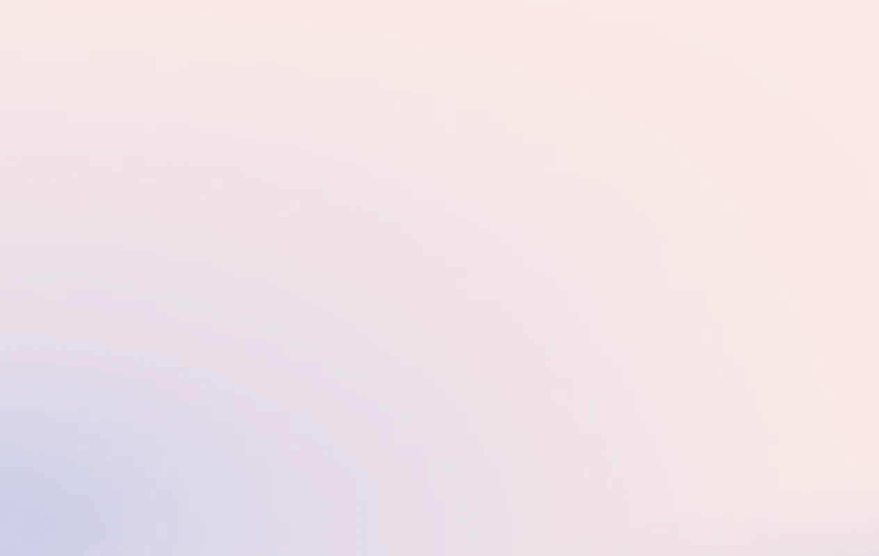 Abstract smooth gradient background with soft pastel shades of pink, purple, and blue blending seamlessly.