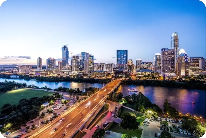 Cloud Gate sculpture, also known as The Bean, reflecting surrounding buildings and people in Millennium Park, Chicago.