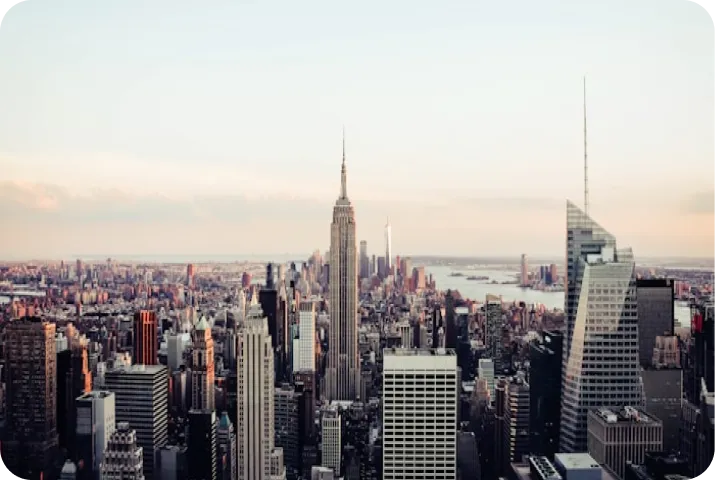 Cloud Gate sculpture, also known as The Bean, reflecting surrounding buildings and people in Millennium Park, Chicago.