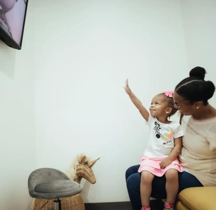 Photo of a mom and her daughter in the Pediatric Smiles lobby