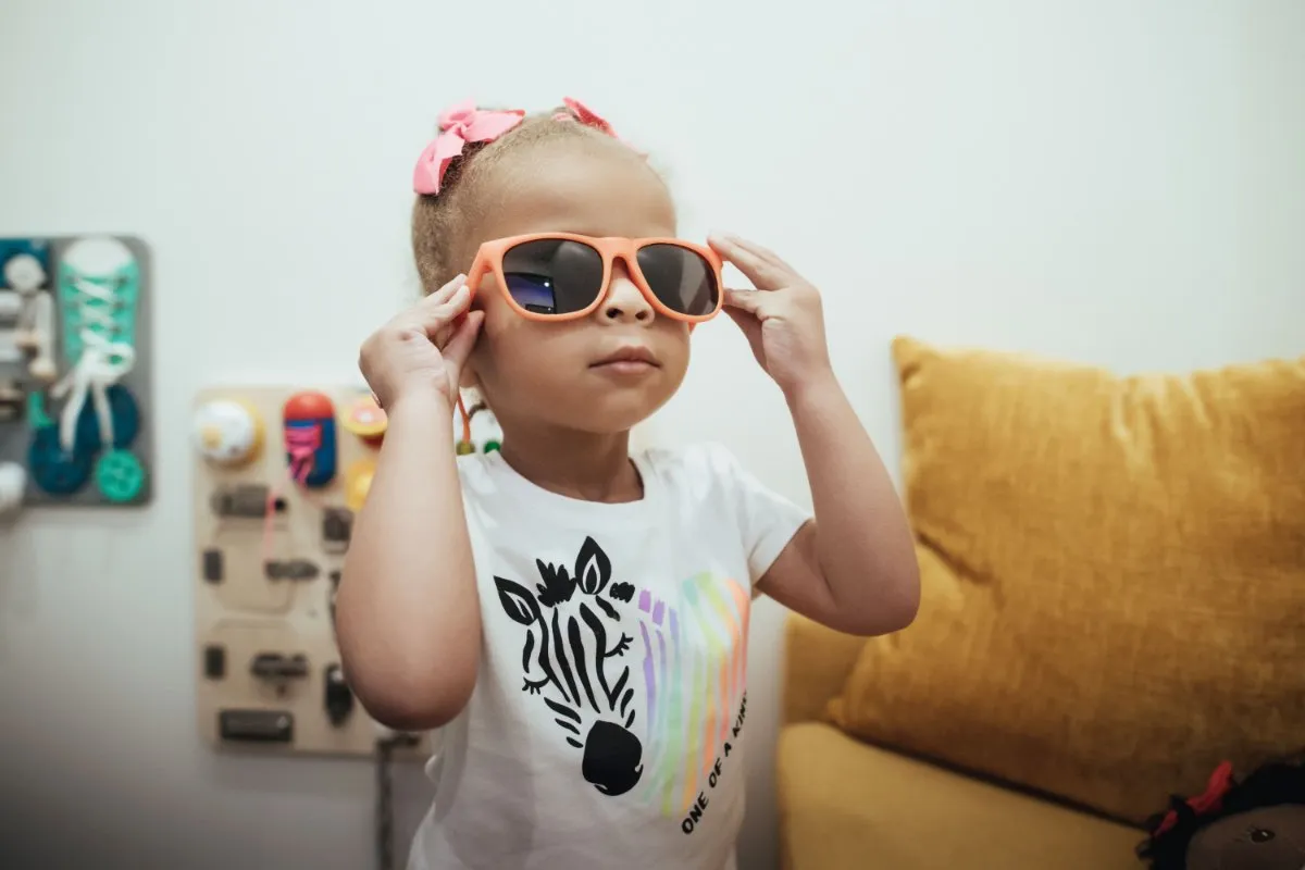 Photo of a young patient wearing sunglasses