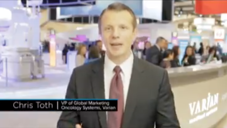 Snapshot of VP of Sales talking at the ASTRO trade show from Varian