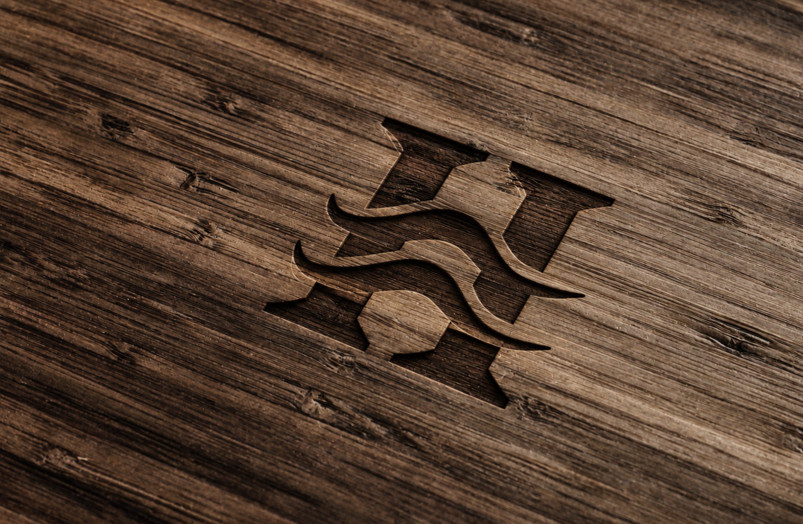 Slate Hollow S monogram burned into dark wood planks