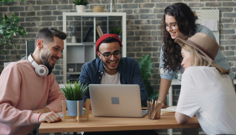 Four colleagues digitally work together