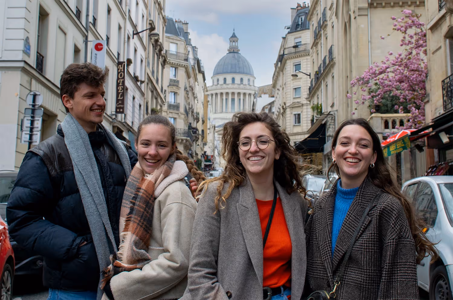 4 people in the street of Paris with the Pantheon in the background
