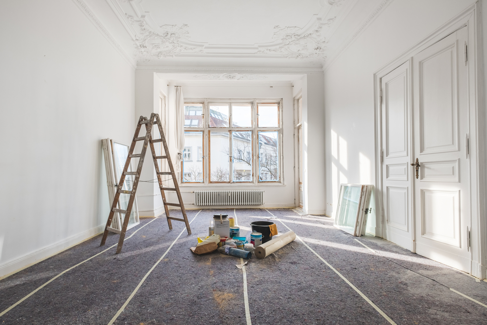 Large bedroom with high ceilings being renovated