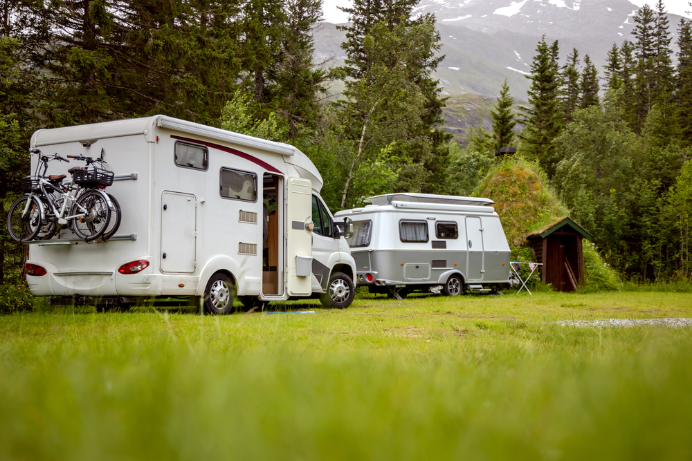 two touring caravans parked up on grass