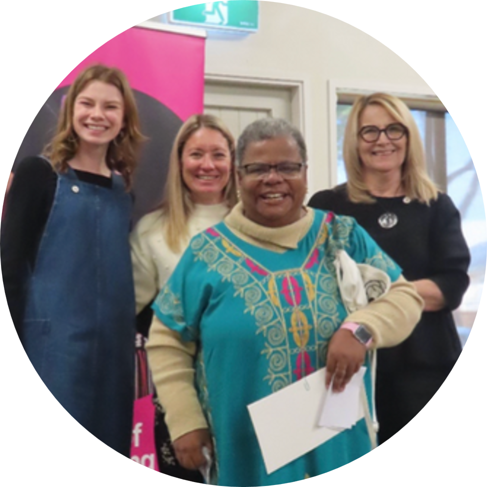 Cora after receiving her SVA bronze badge, with staff from IDEA Services and SVA