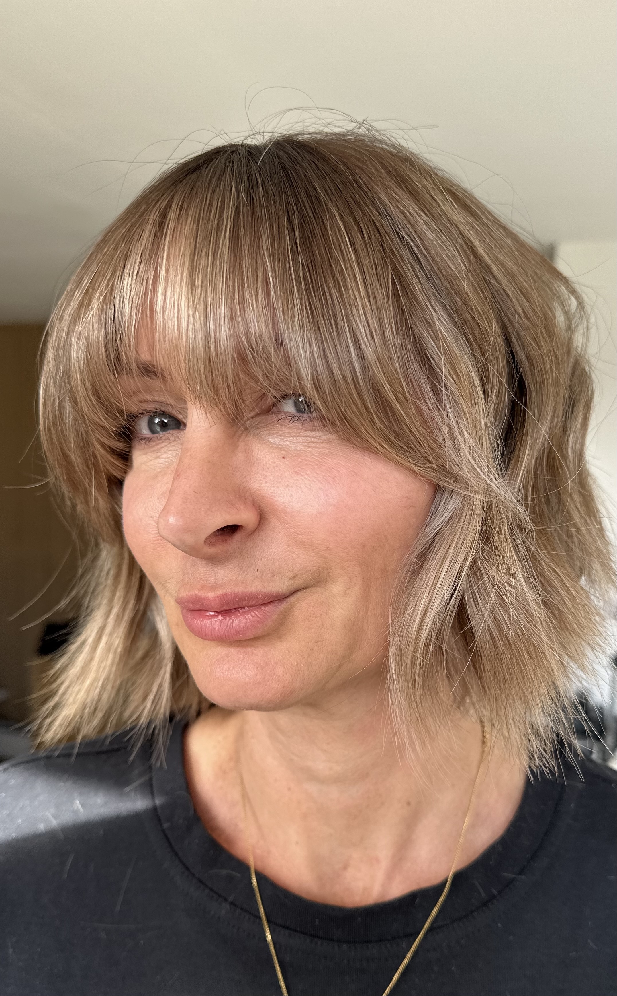 After photo of my client's hair. Wavy hair with blond highlights.