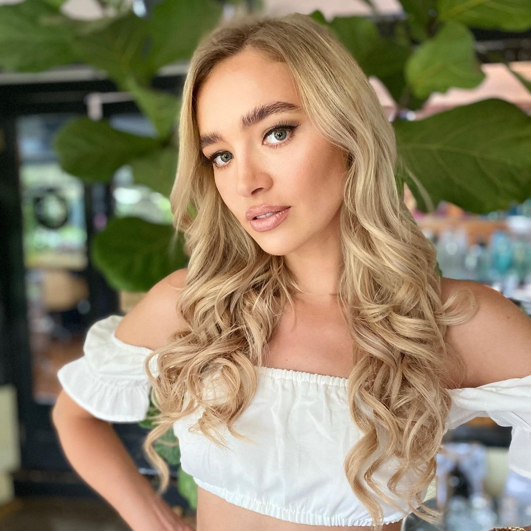A blonde curled hair haircut by Miss Audrey Hair