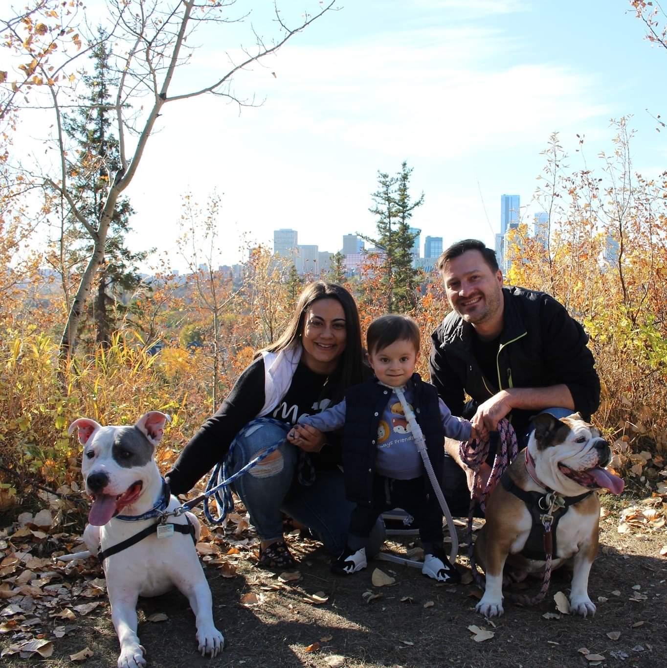 Picture of Chastity Simon with husband, son and two dogs