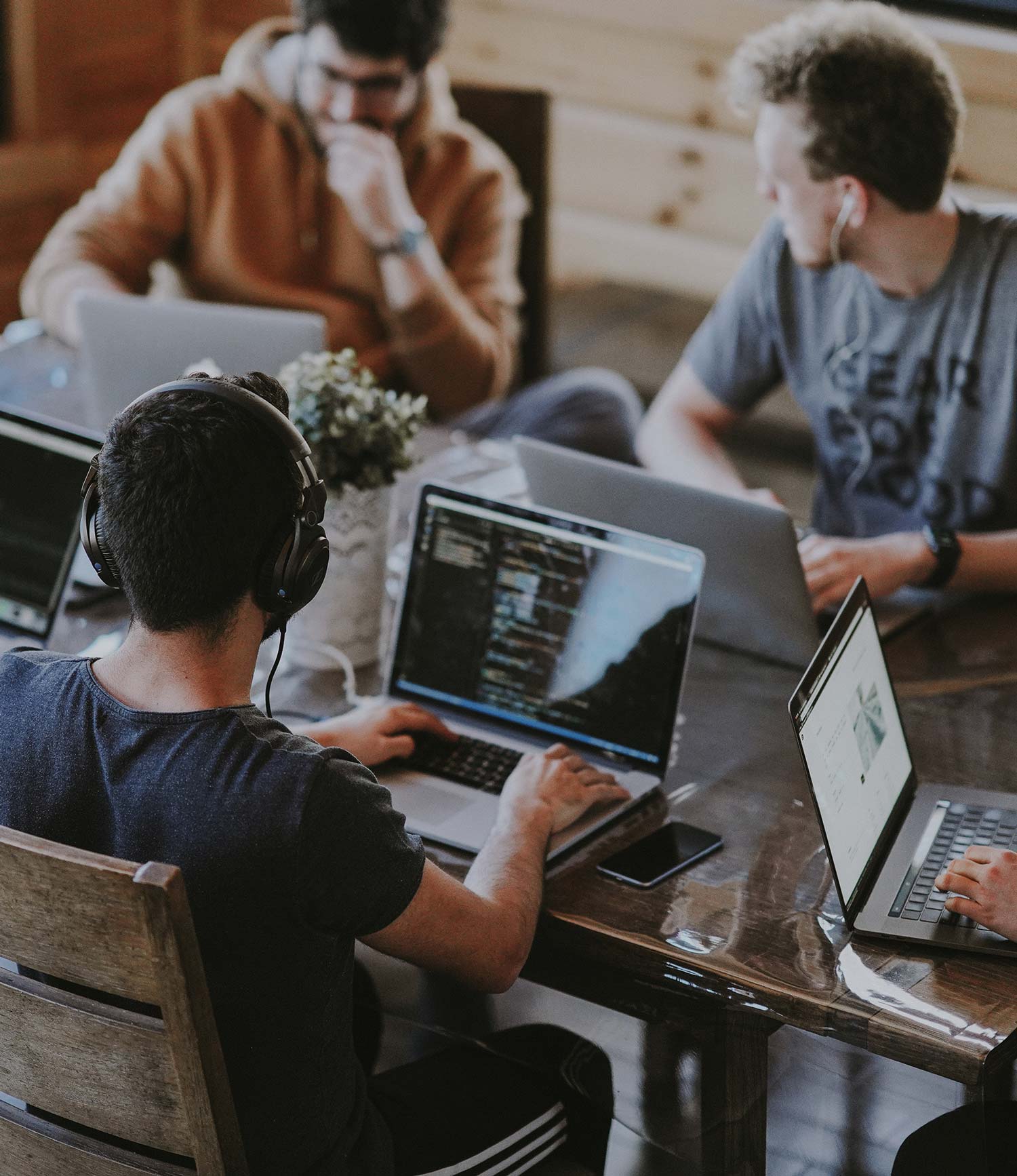 Image of 3 men working on computers