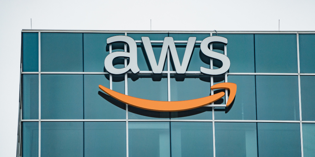 Exterior image of the corporate AWS office building with their company logo sign installed over windows.