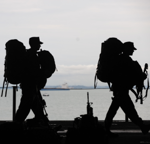 Two American soldiers likely going into battle