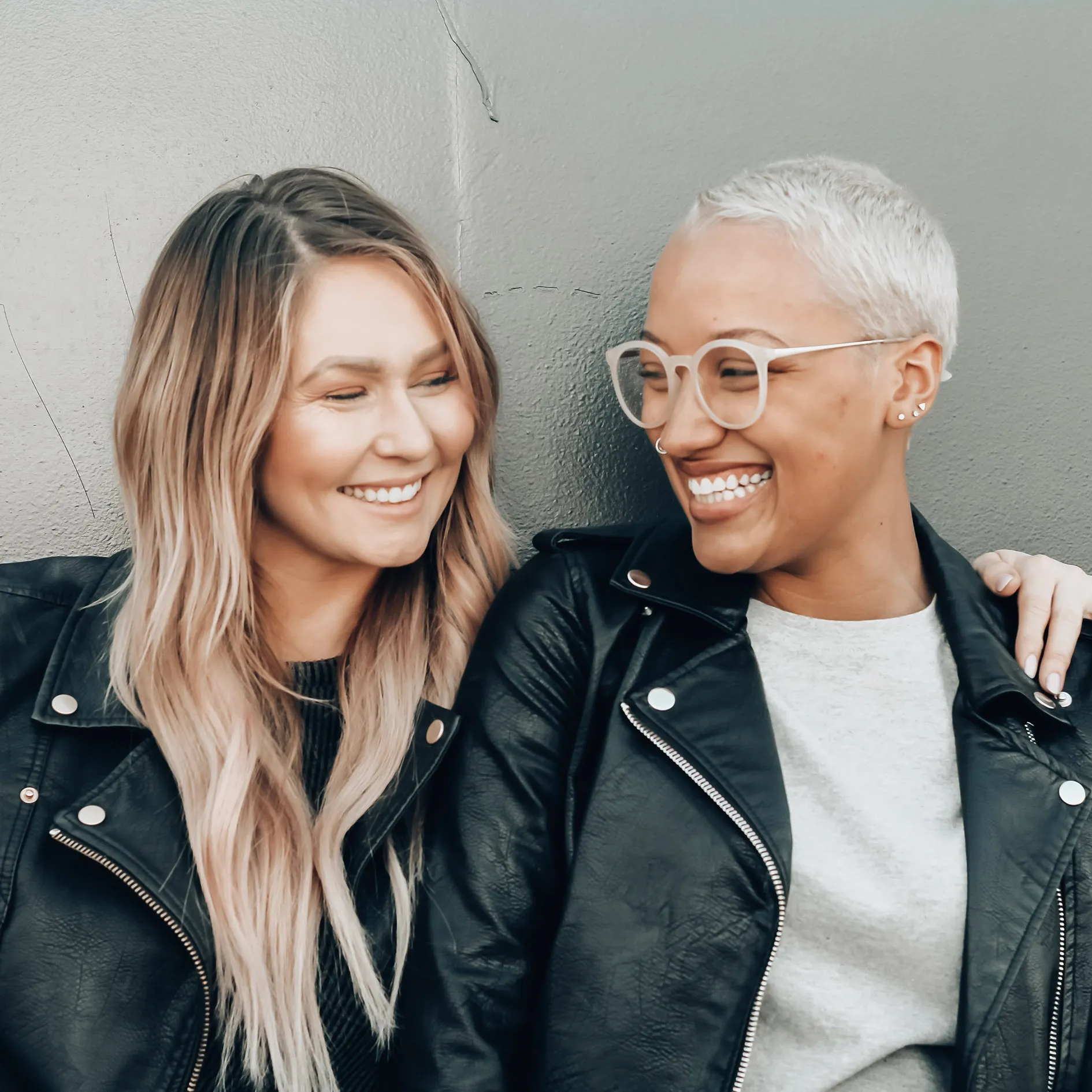 Two women happy they can lend money to each other.