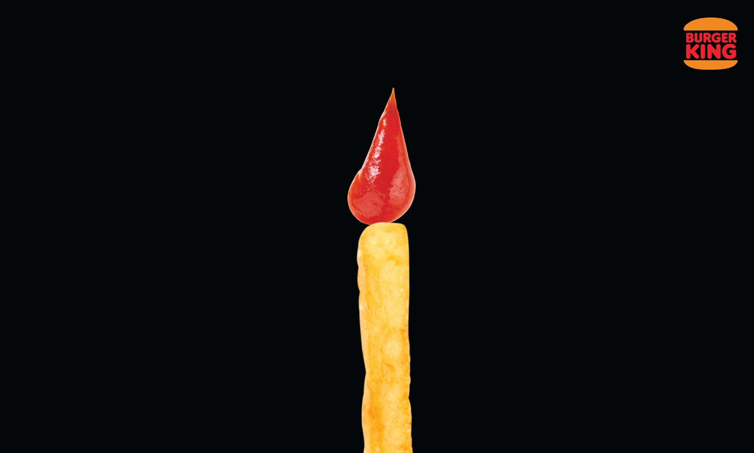 Successful year celebration ad with a fry and a drop of ketchup making a candle