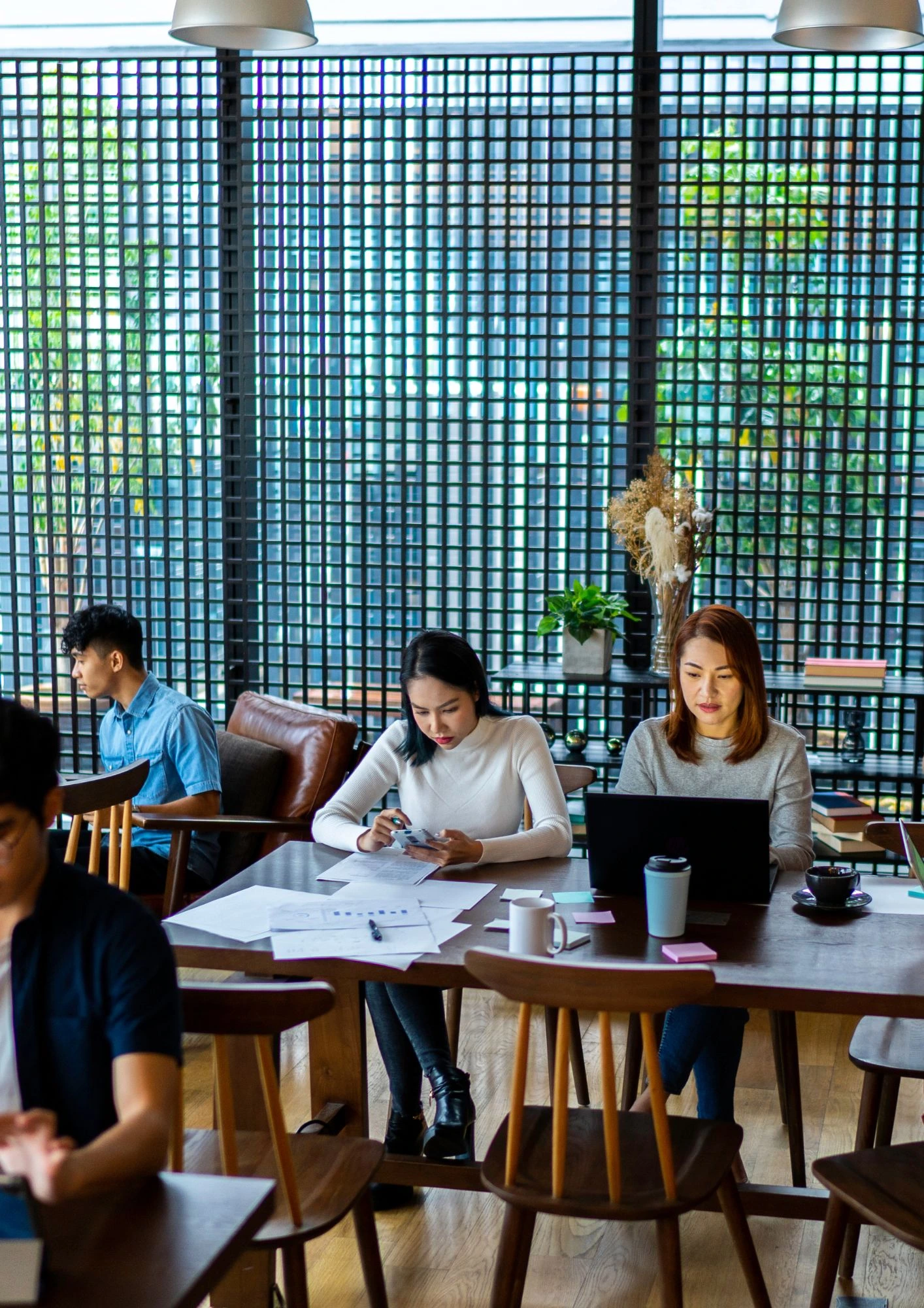 People collaborating in the workplace, reflecting teamwork and evidence-based decision-making.