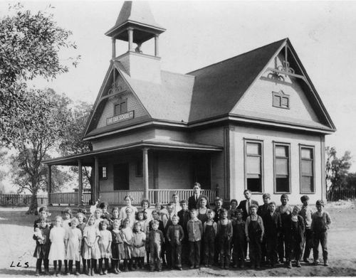 Archival photo of teachers and students in front of Live Oak School, Oakley c1912