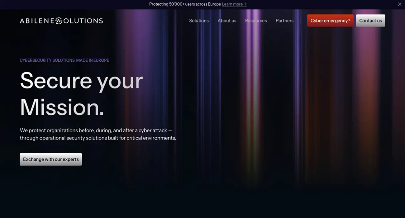 Main hero of the Abilene Solutions website featuring the Secure your Mission tagline with a video background in purple and red gradients