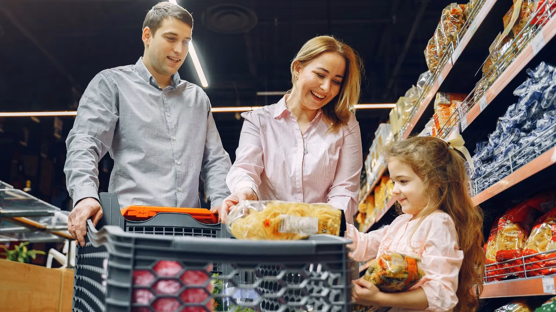 Family with cart in supermarket