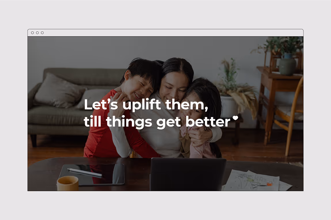 A mother hugging her two children warmly in a living room with text overlay: 'Let's uplift them, till things get better.'