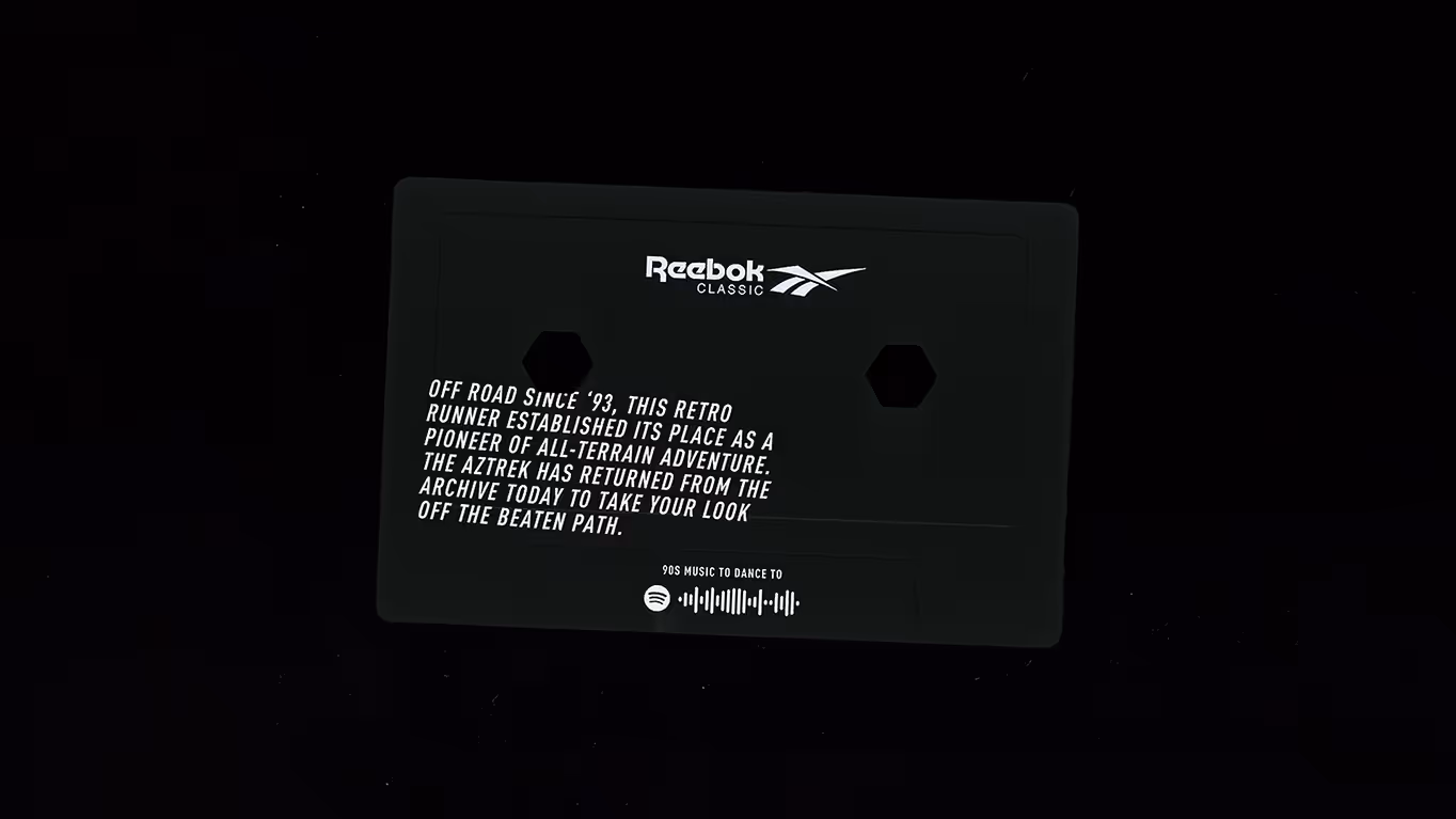 Black Reebok Classic card with white text about the Aztrek retro runner and a Spotify code for 90s music.