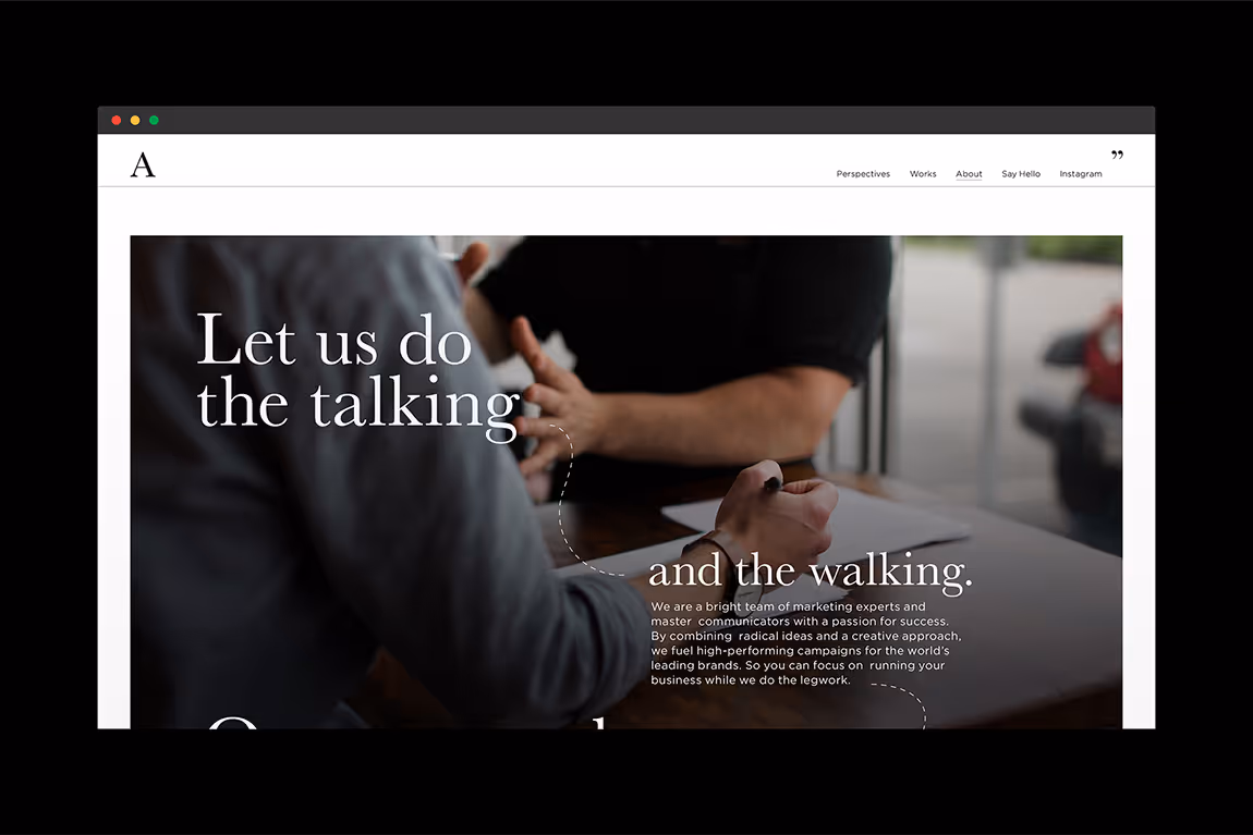 Website homepage showing two people discussing at a table with text overlay 'Let us do the talking and the walking' and a marketing message.