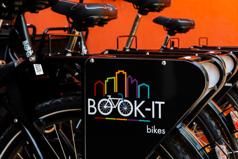 A bunch of bikes that are parked next to each other.