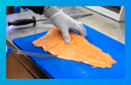 salmon is being cut