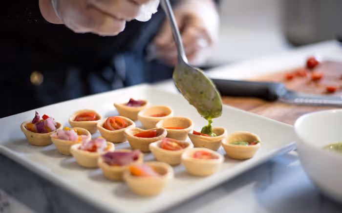 a chef preparing a catering platter