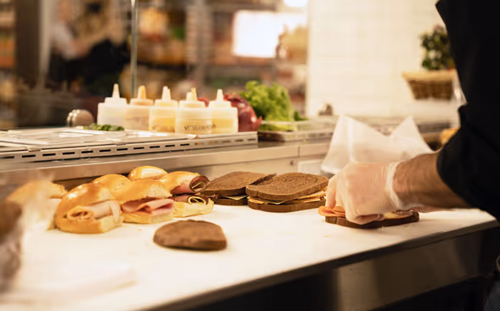 cook preparing sandwiches
