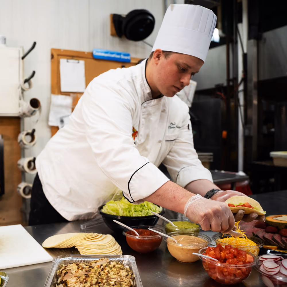 Deli worker preparing an order