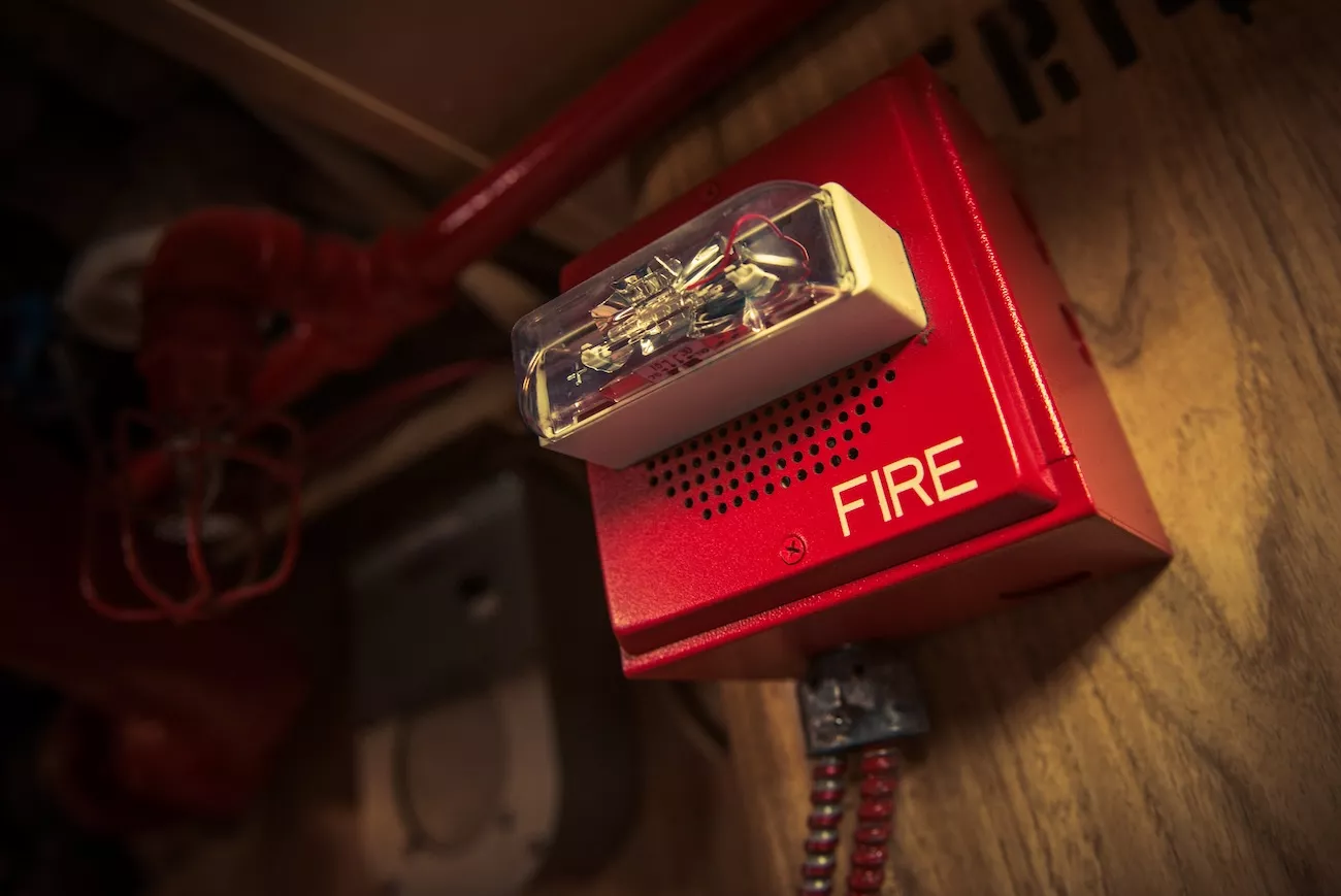 Fire alarm safety system installed on a wall. 