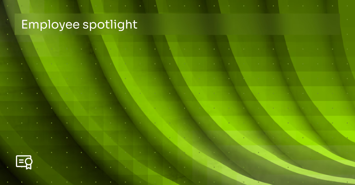 Green abstract background with curved, layered shapes and small squares, featuring white text reading 'Employee spotlight' and a certificate icon in the bottom left corner.